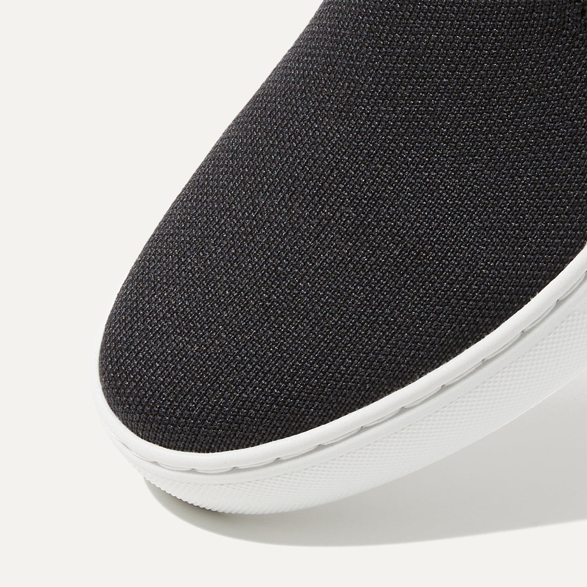 Rothys The Original Slip On Sneaker in Black Solid